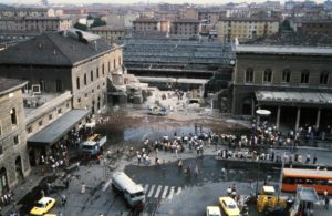 General view of Bologna Central station and of wagons of the Ancona-Chiasso train pictured on August 02, 1980 in Bologna after a terrorist bombing which killed 85 people and wounded more than 200. At 10:25 am., August 02, a timed improvised explosive device (IED) contained in an unattended suitcase detonated inside an air-conditioned waiting room, which, the month being August (and with air conditioning being uncommon in Italy at the time), was crammed full of people. The IED was made of TNT, T4 and a "Compound B", also known as Composition B. The explosion destroyed most of the main building and hit the Ancona–Chiasso train that was waiting at the first platform. The attack has been attributed to the neo-fascist terrorist organization,